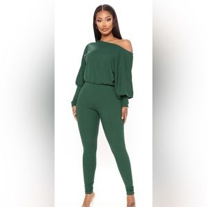Green jumpsuit with off shoulder and quarter length sleeves. NWT